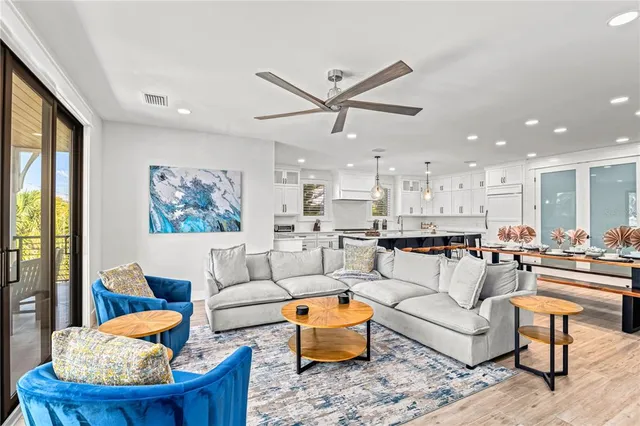 a bathroom with a double vanity sink toilet and shower