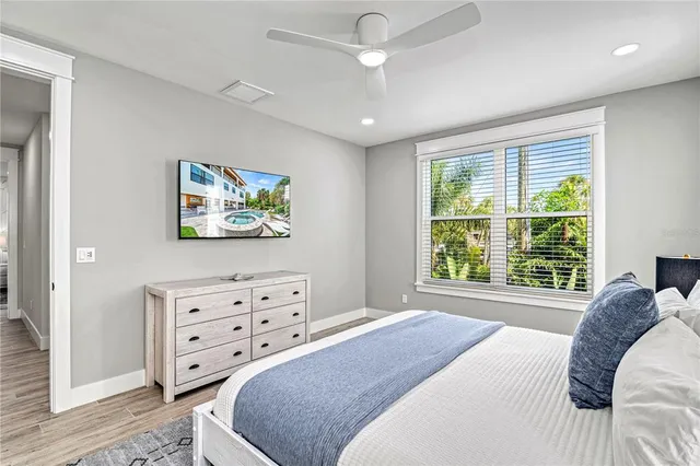 a bedroom with a bed and a dresser