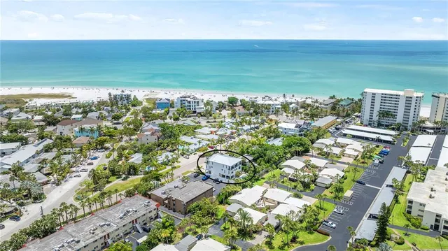 a kitchen with stainless steel appliances a sink a stove and a window