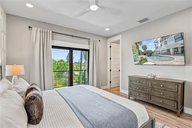 a view of a house with swimming pool and sitting area