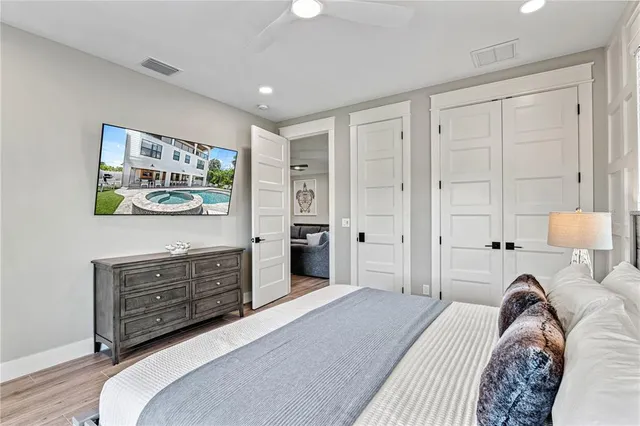 a view of a house with swimming pool and sitting area