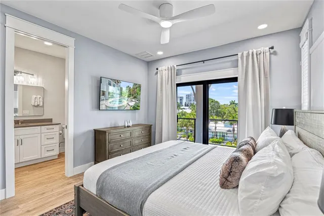 a dining room with furniture a rug and a large window
