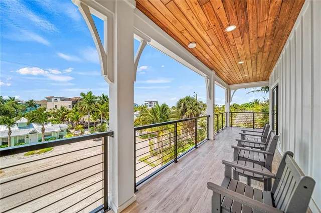 a view of a patio with couches chairs and potted plants
