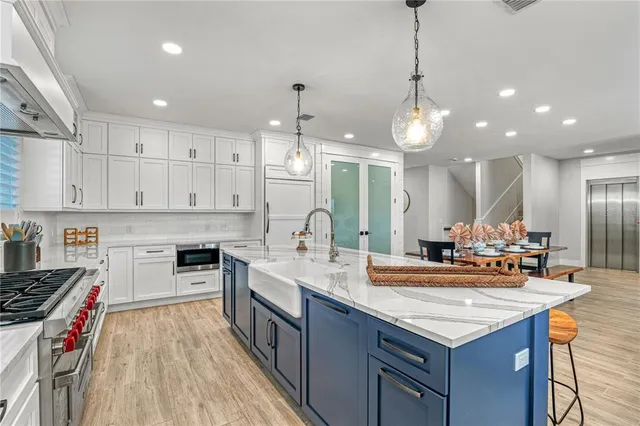 a living room with furniture and kitchen view
