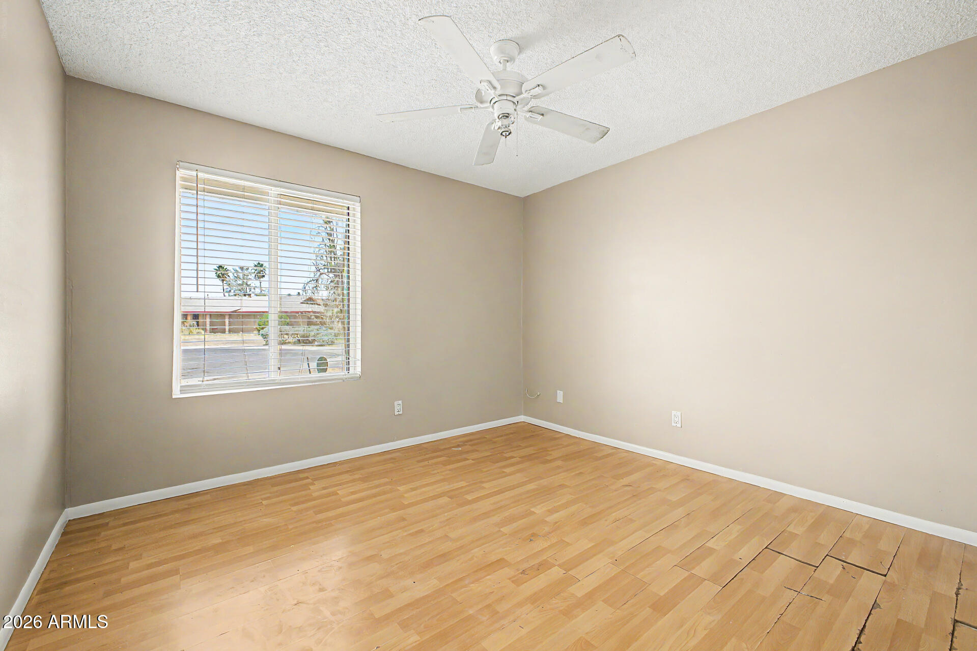 4007 West Mountain View Road Phoenix, AZ 85051 - Photo 25 of 31 an empty room with a window