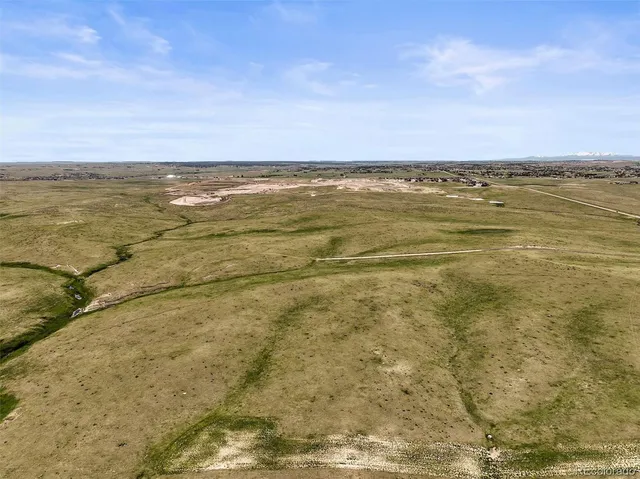 a view of a field with beach