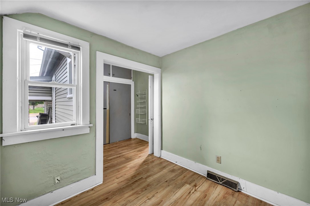 816 Perry Street Sandusky, OH 44870 - Photo 20 of 38 Spare room featuring wood finished floors