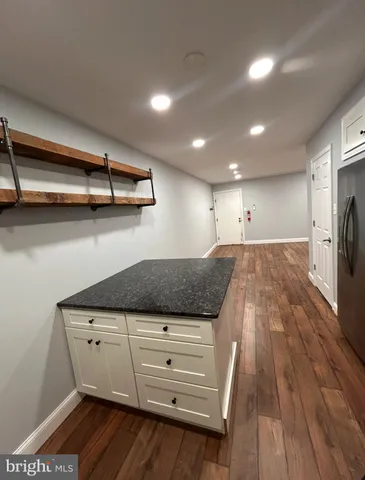 a view of cabinets and wooden floor