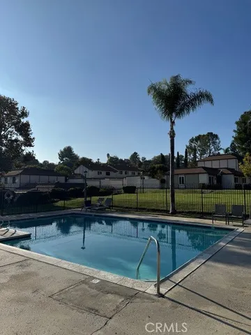 a view of a balcony with two chairs