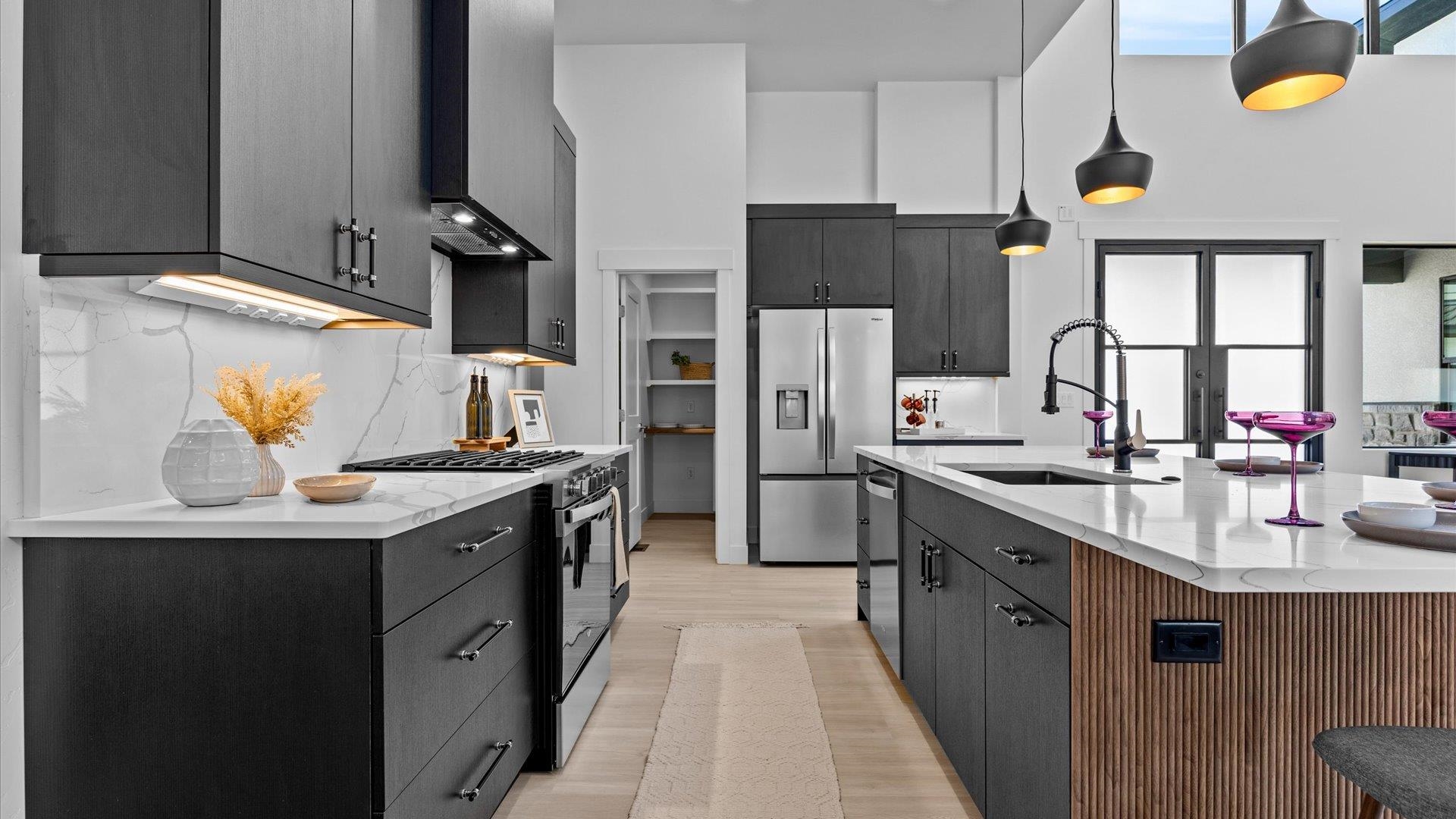 2045 Caleb Street Grand Junction, CO 81507 - Photo 15 of 42 a kitchen with stainless steel appliances a sink stove and refrigerator