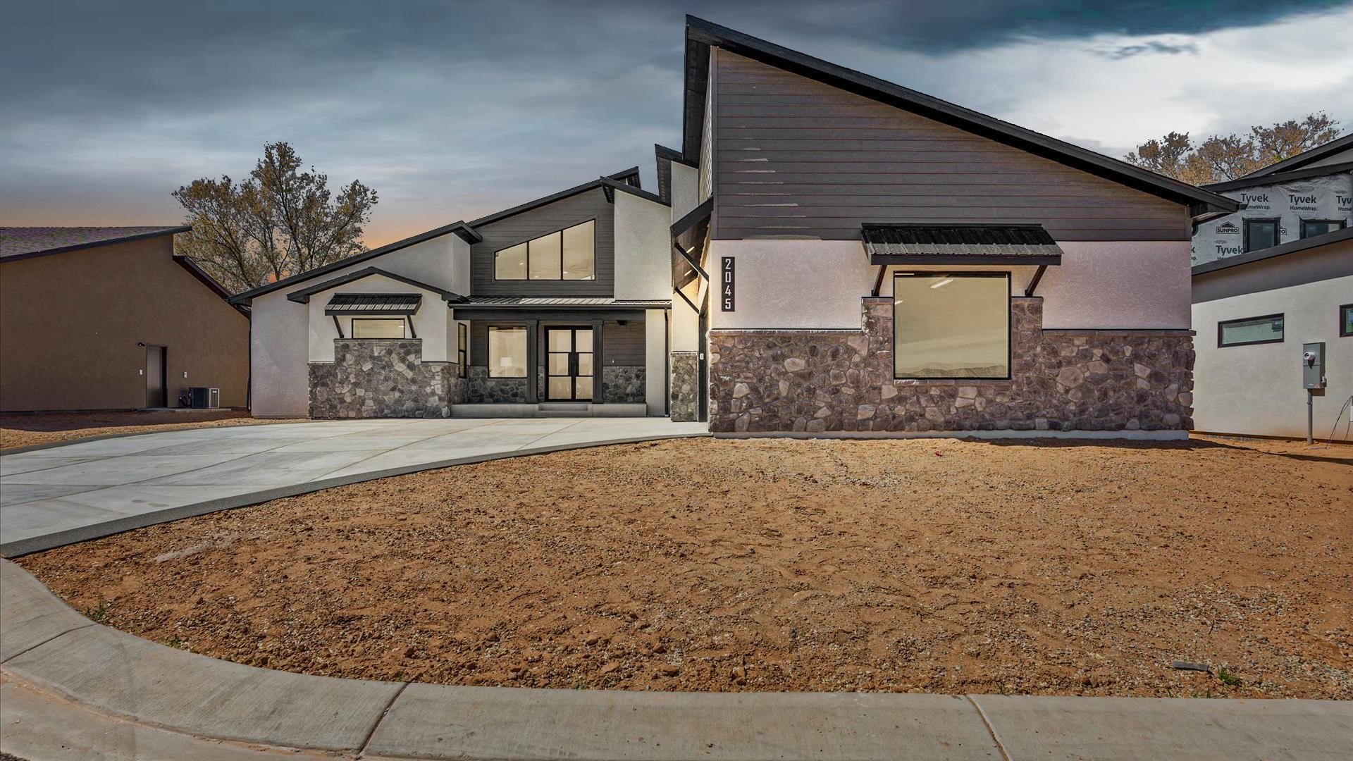 2045 Caleb Street Grand Junction, CO 81507 - Photo 2 of 42 a front view of a house with a yard