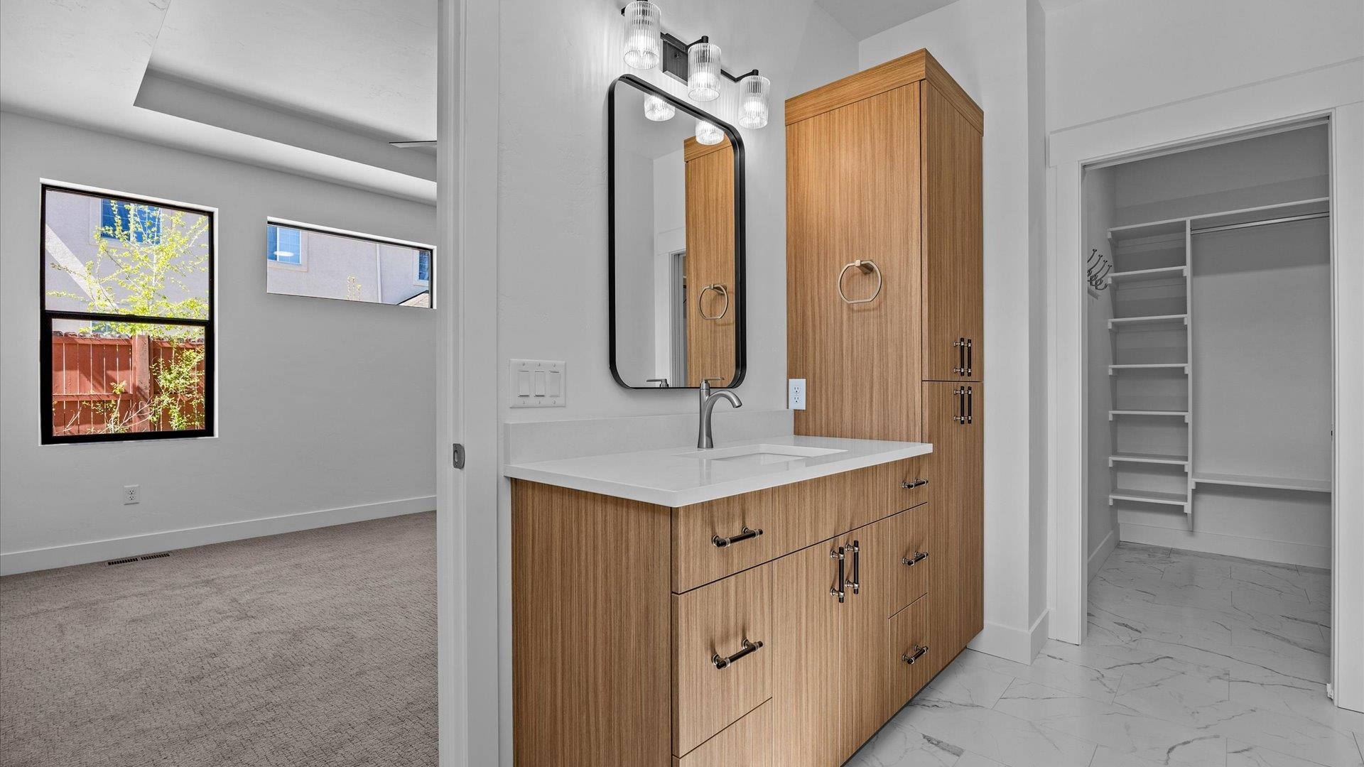 2045 Caleb Street Grand Junction, CO 81507 - Photo 27 of 42 a bathroom with a sink a mirror and a vanity