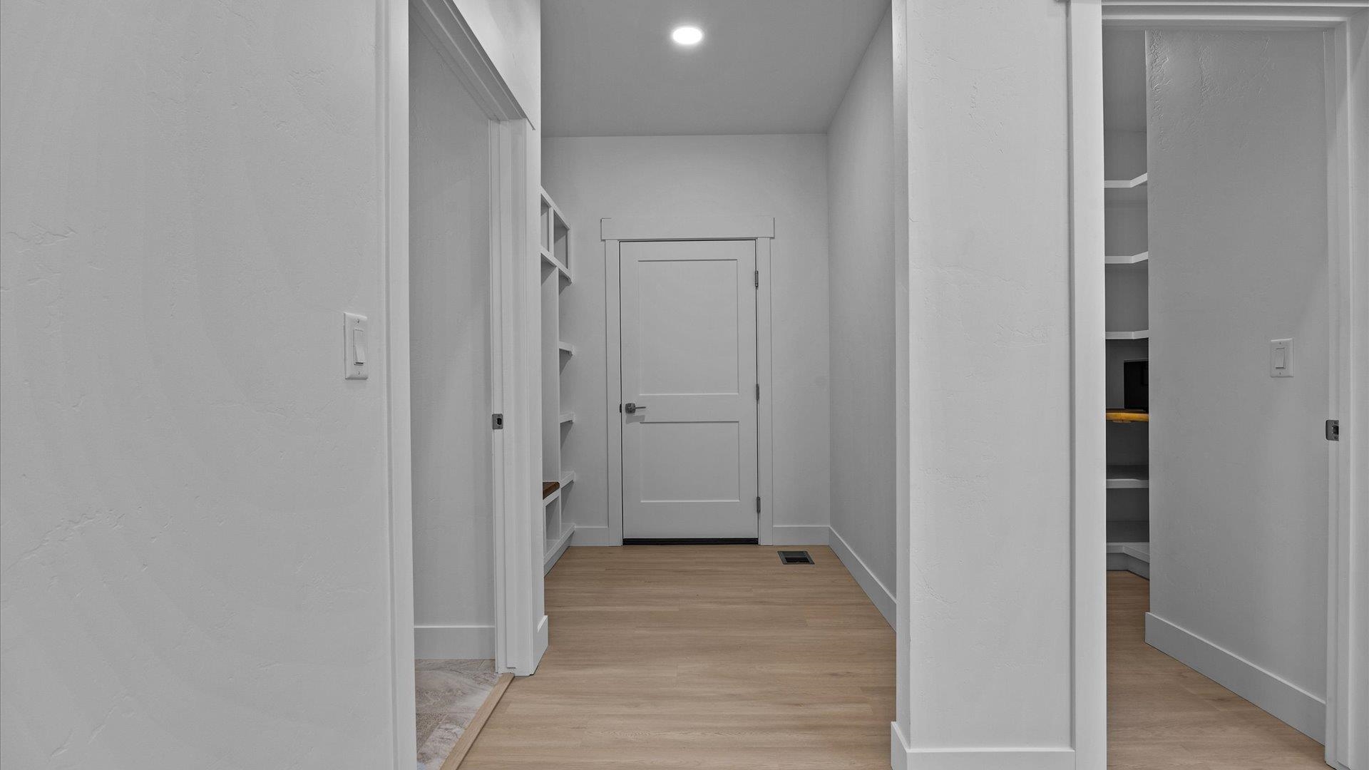 2045 Caleb Street Grand Junction, CO 81507 - Photo 32 of 42 a view of a hallway with wooden floor