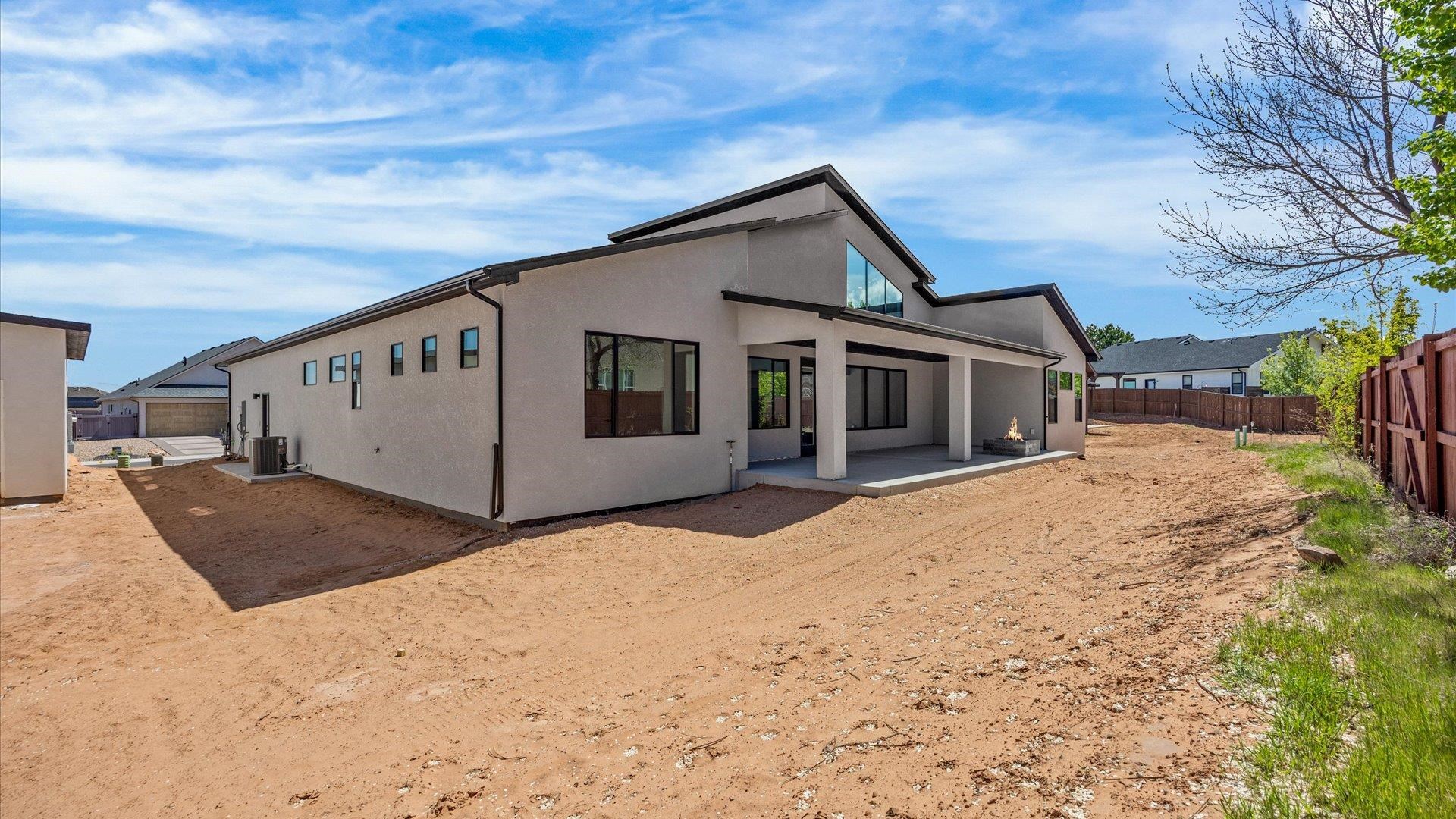 2045 Caleb Street Grand Junction, CO 81507 - Photo 42 of 42 a front view of a house with a yard covered in snow