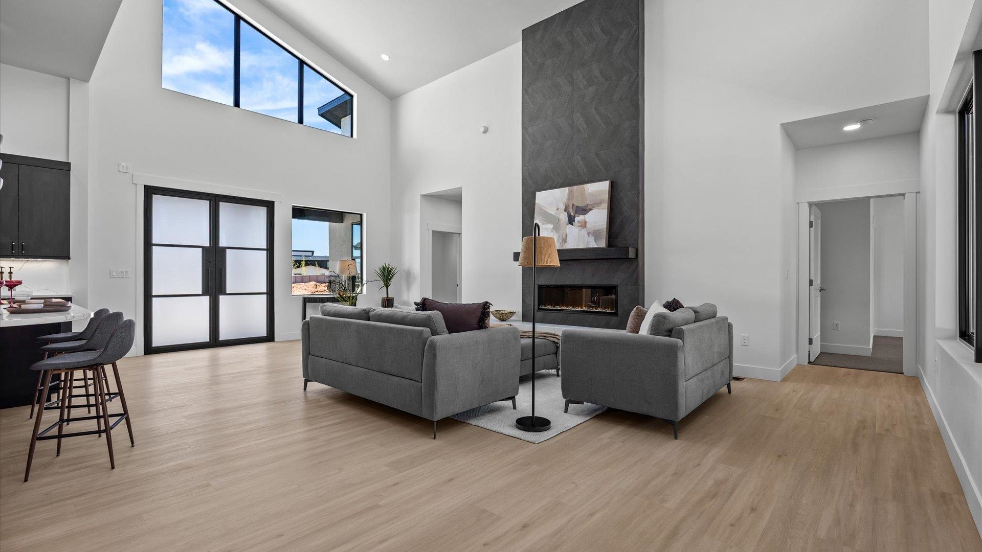 2045 Caleb Street Grand Junction, CO 81507 - Photo 5 of 42 a living room with furniture a flat screen tv and a fireplace