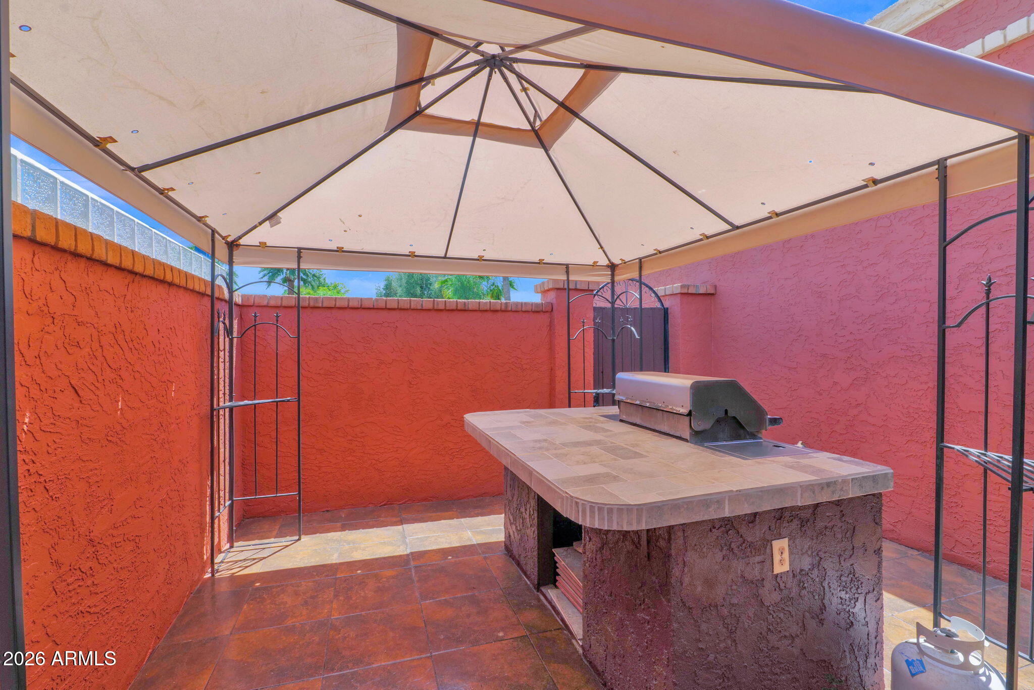 507 West Knox Road Chandler, AZ 85225 - Photo 25 of 34 a table and chairs in a umbrella