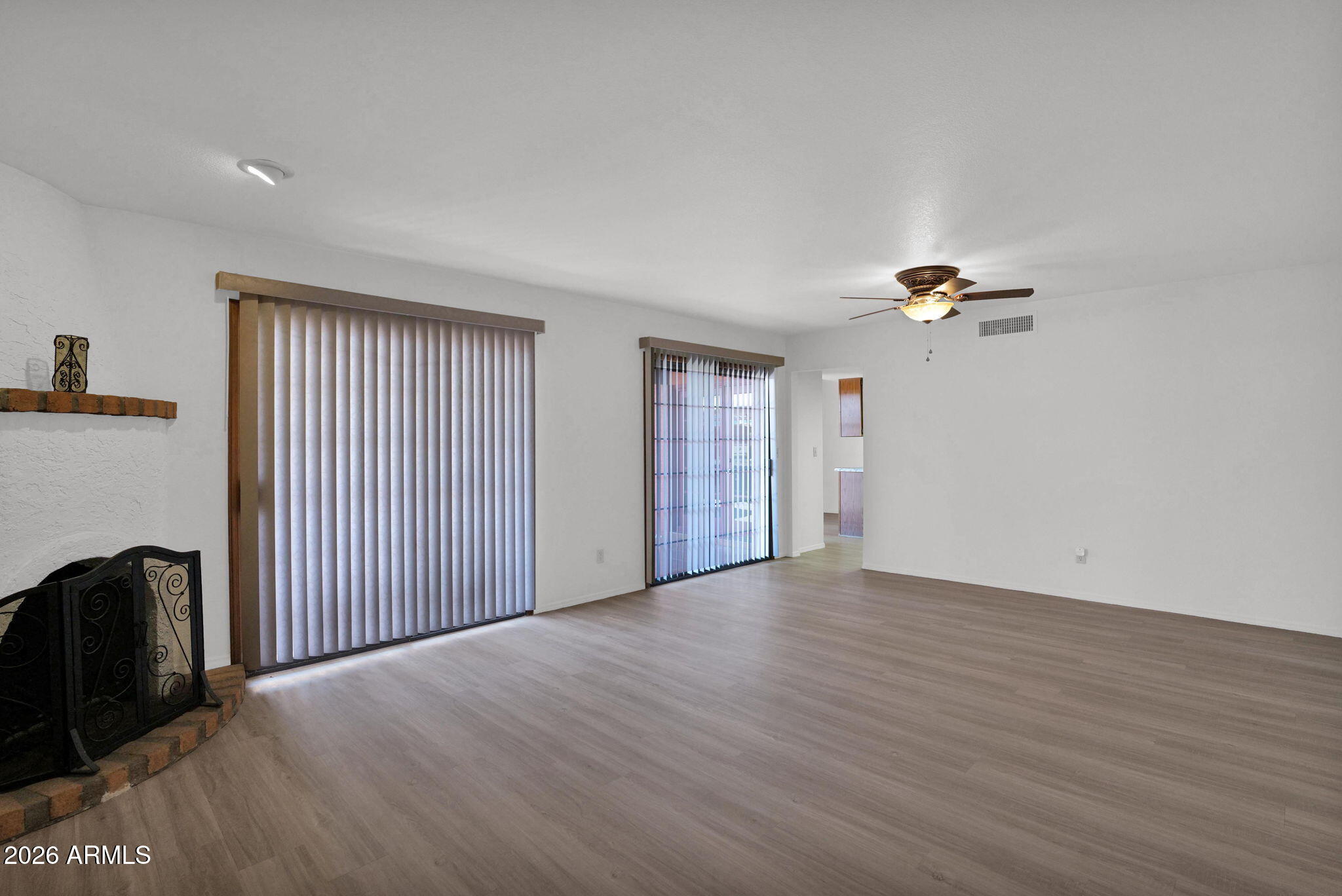 507 West Knox Road Chandler, AZ 85225 - Photo 5 of 34 a view of an empty room with wooden floor