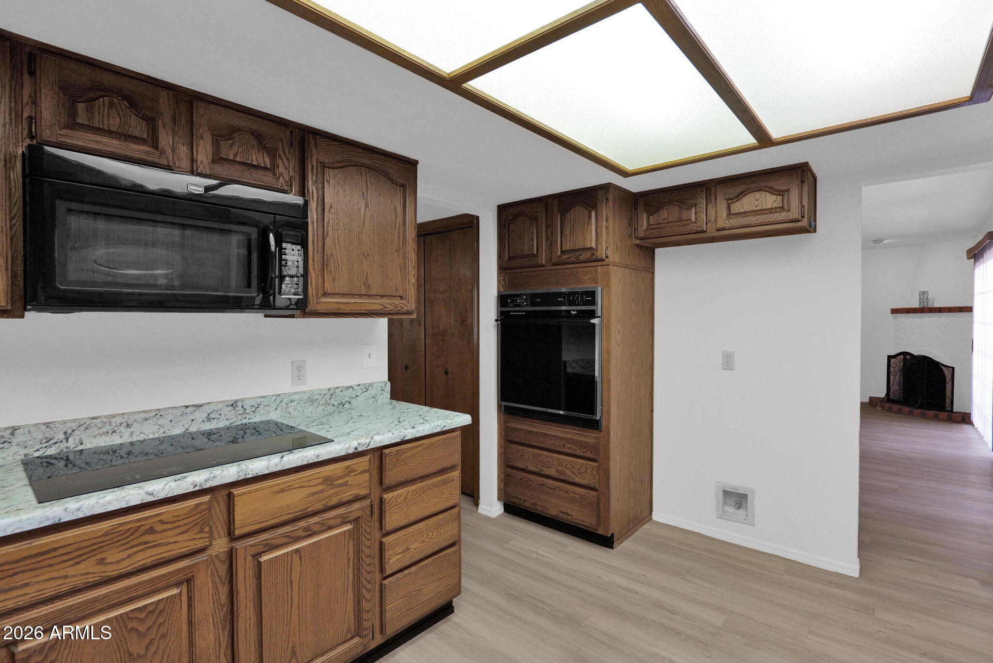 507 West Knox Road Chandler, AZ 85225 - Photo 10 of 34 a kitchen with stainless steel appliances granite countertop a refrigerator and a stove top oven