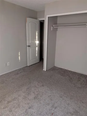 a kitchen with granite countertop a stove and a sink