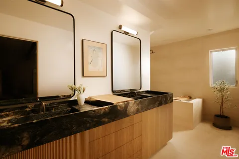 a bathroom with a tub and shower