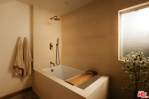 a terrace with outdoor seating and trees