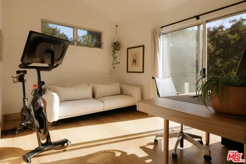 a balcony with table and chairs