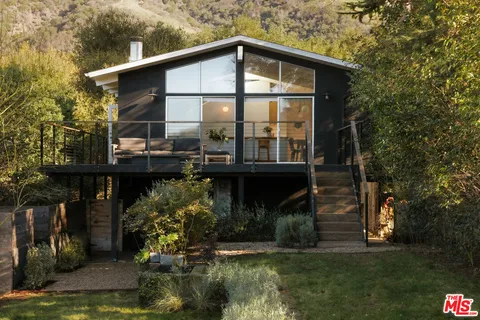 a view of a terrace with sitting area