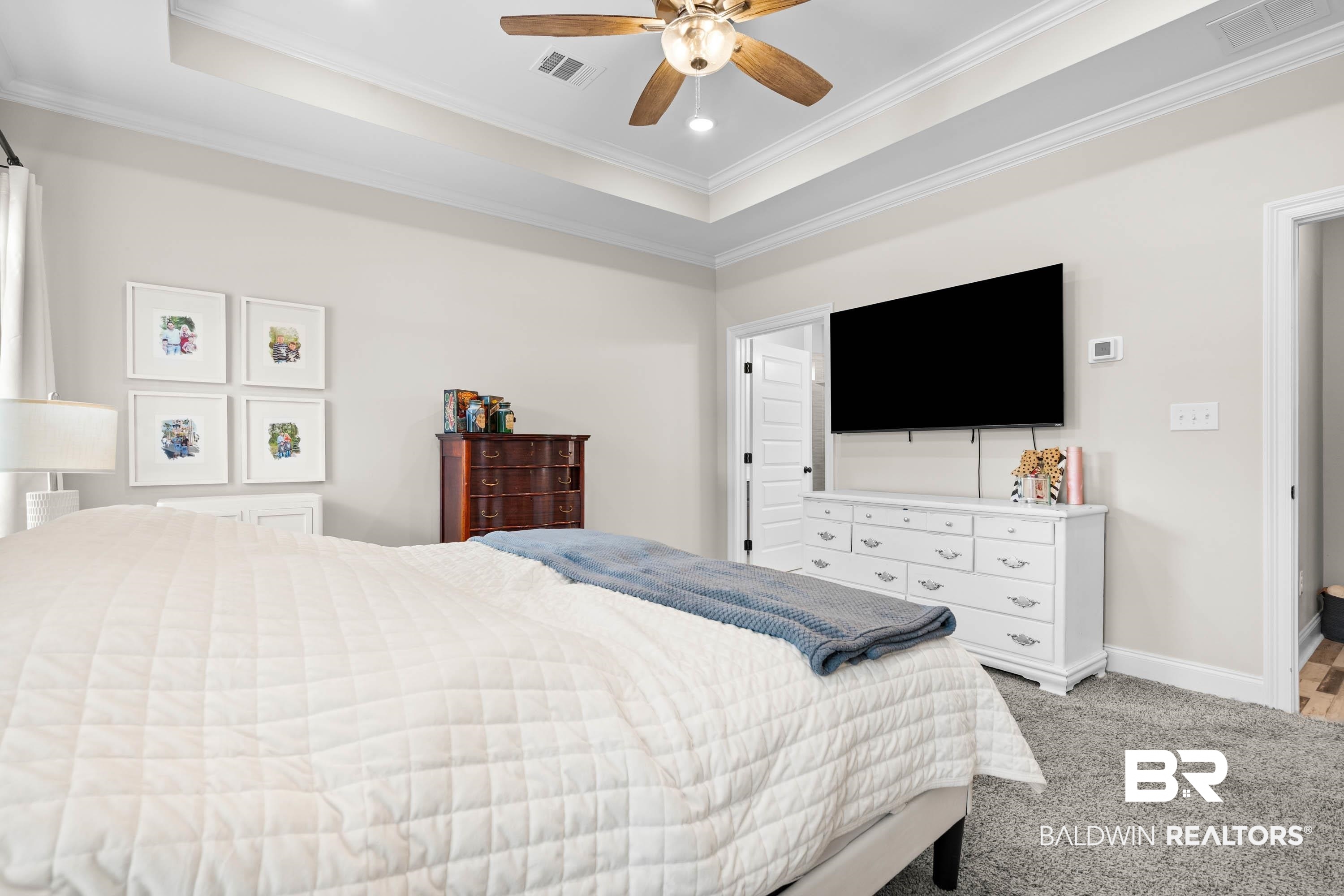 7150 Powell Road, Unit LOT 6A Eight Mile, AL 36613 - Photo 11 of 35 Bedroom with ornamental molding, a raised ceiling, ceiling fan, light colored carpet, and recessed lighting