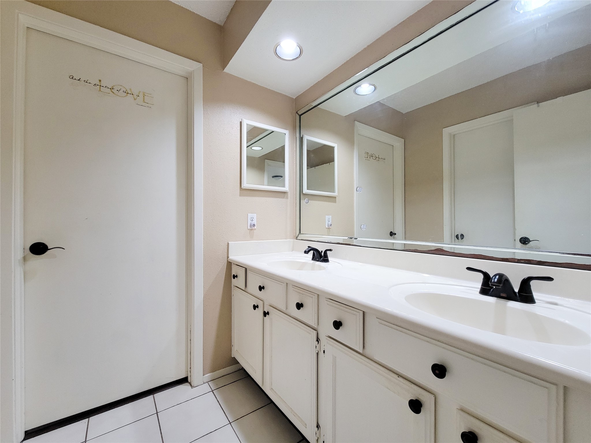 25303 Avery Hill Lane Spring, TX 77373 - Photo 11 of 20 a bathroom with a double vanity sink and mirror