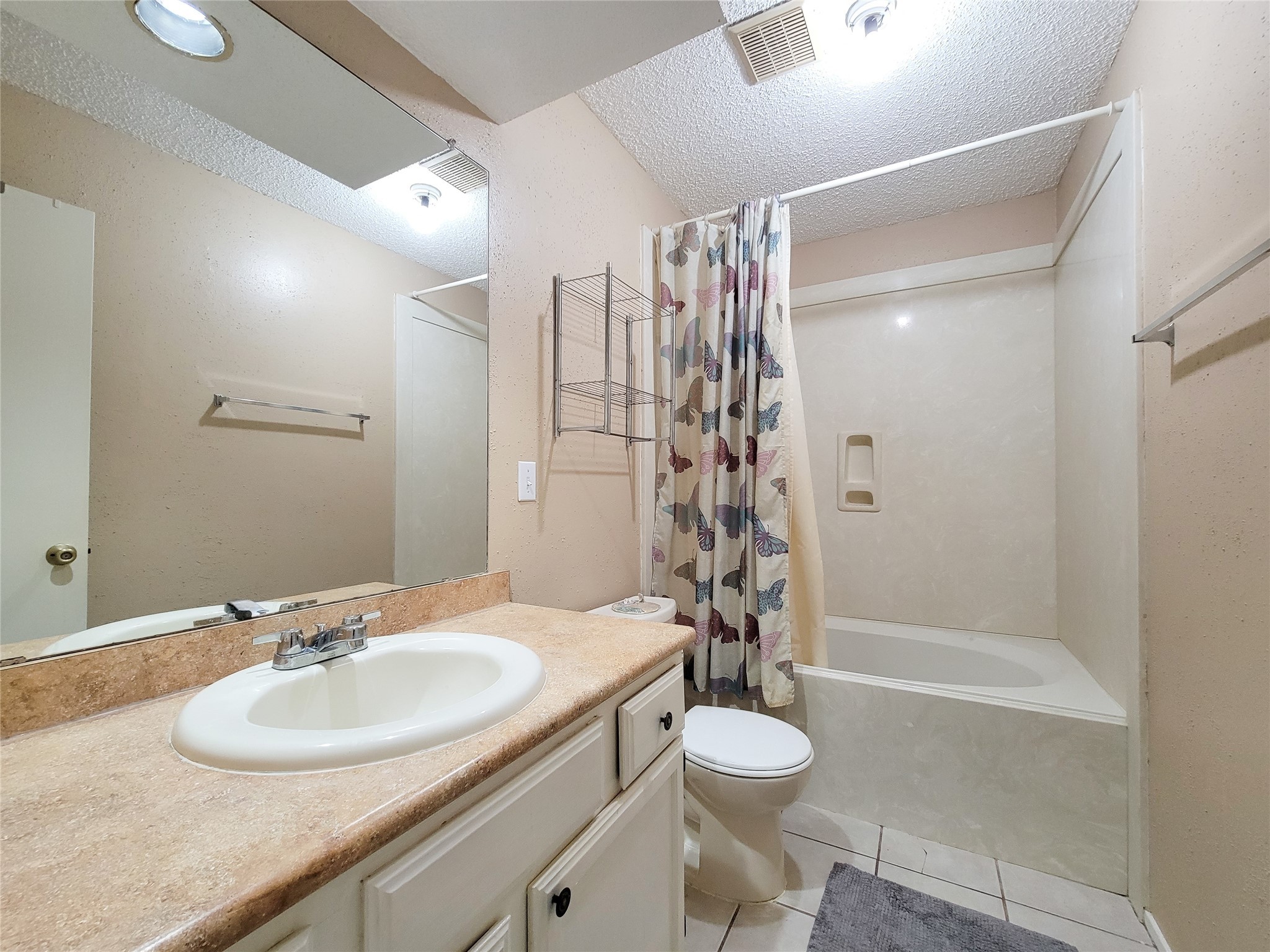 25303 Avery Hill Lane Spring, TX 77373 - Photo 15 of 20 a bathroom with a granite countertop sink toilet and shower