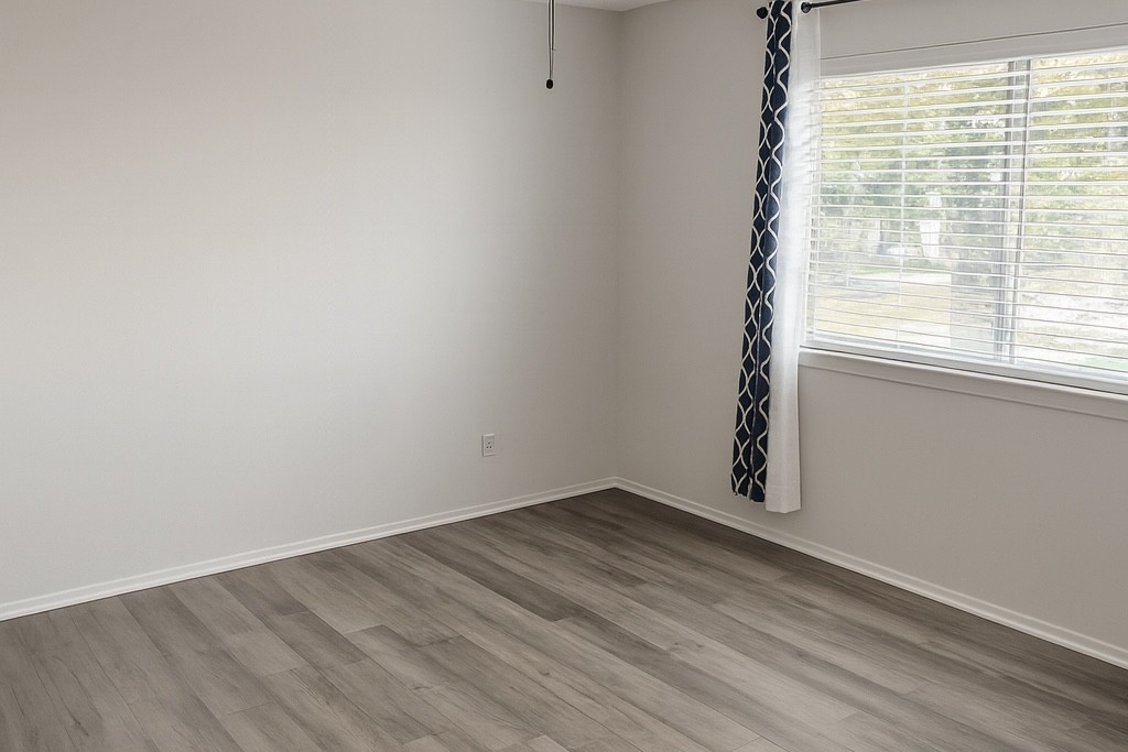 25303 Avery Hill Lane Spring, TX 77373 - Photo 16 of 20 wooden floor in an empty room with a window
