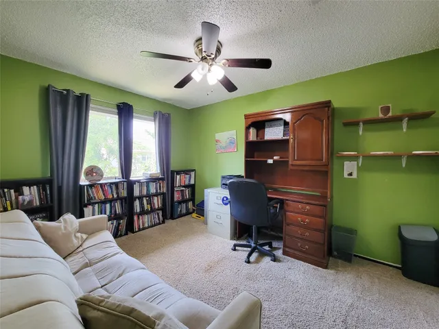 a workspace with furniture and a window