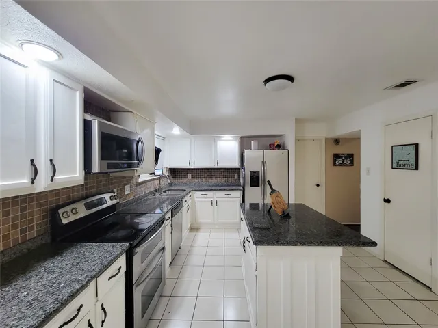 a view of a hallway with stairs