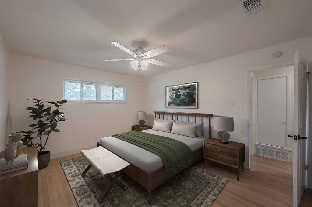 3031 Woodwind Lane Dallas, TX 75229 - Photo 12 of 29 a bedroom with a large bed and a chandelier