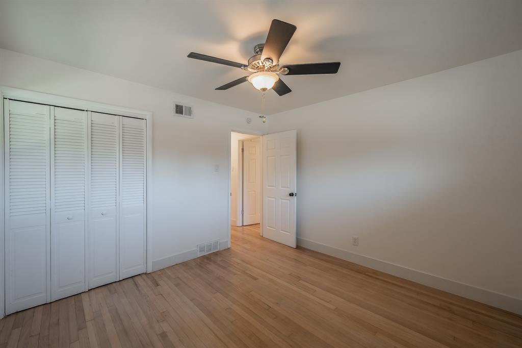 3031 Woodwind Lane Dallas, TX 75229 - Photo 24 of 29 wooden floor in an empty room