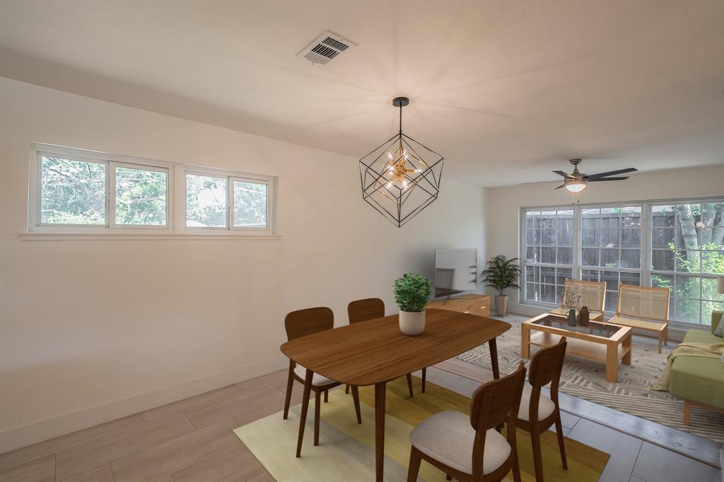 3031 Woodwind Lane Dallas, TX 75229 - Photo 7 of 29 a view of a dining room with furniture window and outside view