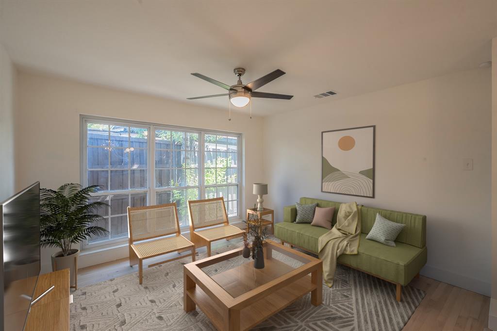 3031 Woodwind Lane Dallas, TX 75229 - Photo 10 of 29 a living room with furniture and a large window
