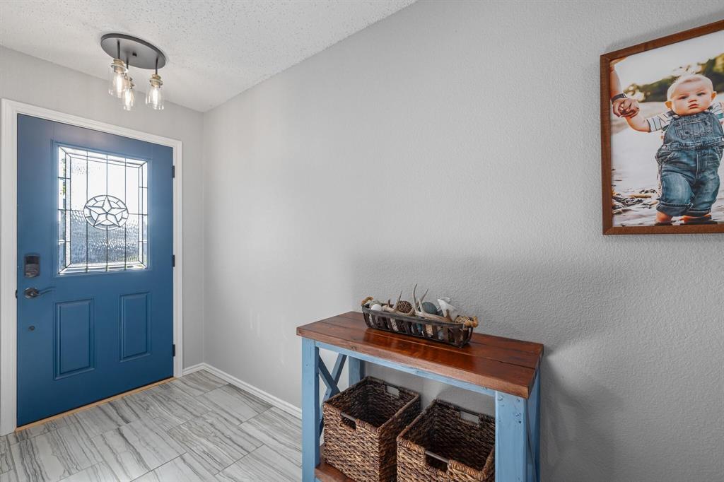 2705 Mitchell Lane Anna, TX 75409 - Photo 3 of 24 a view of room with window and wooden floor