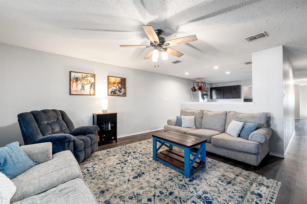 2705 Mitchell Lane Anna, TX 75409 - Photo 5 of 24 a living room with furniture ceiling fan and a rug