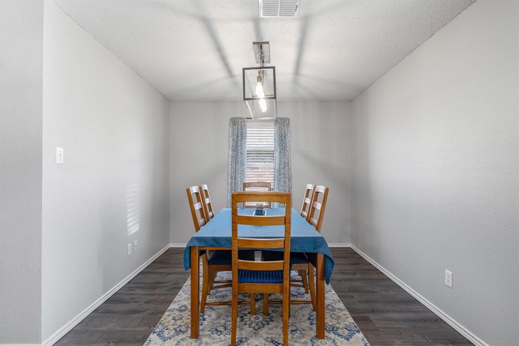 2705 Mitchell Lane Anna, TX 75409 - Photo 10 of 24 a view of staircase with wooden floor and furniture