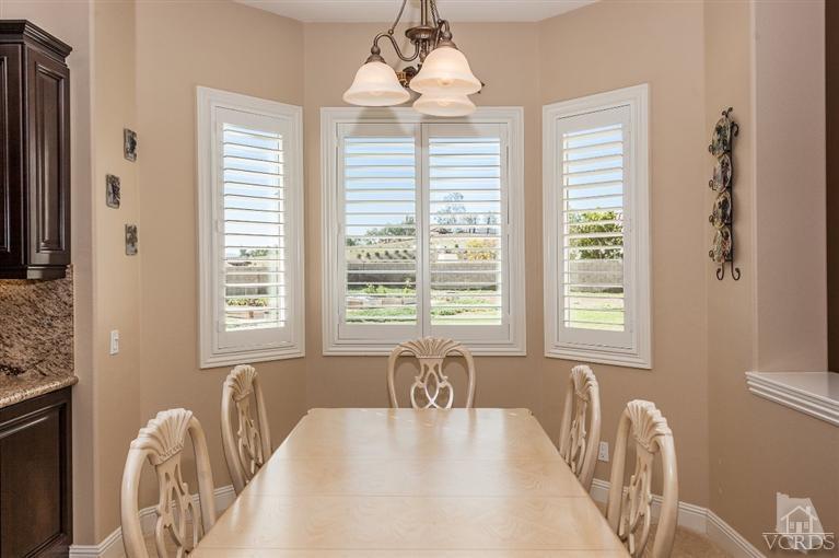 7351 Sarazen Drive Moorpark, CA 93021 - Photo 11 of 39 a large white bed sitting in a room next to a window