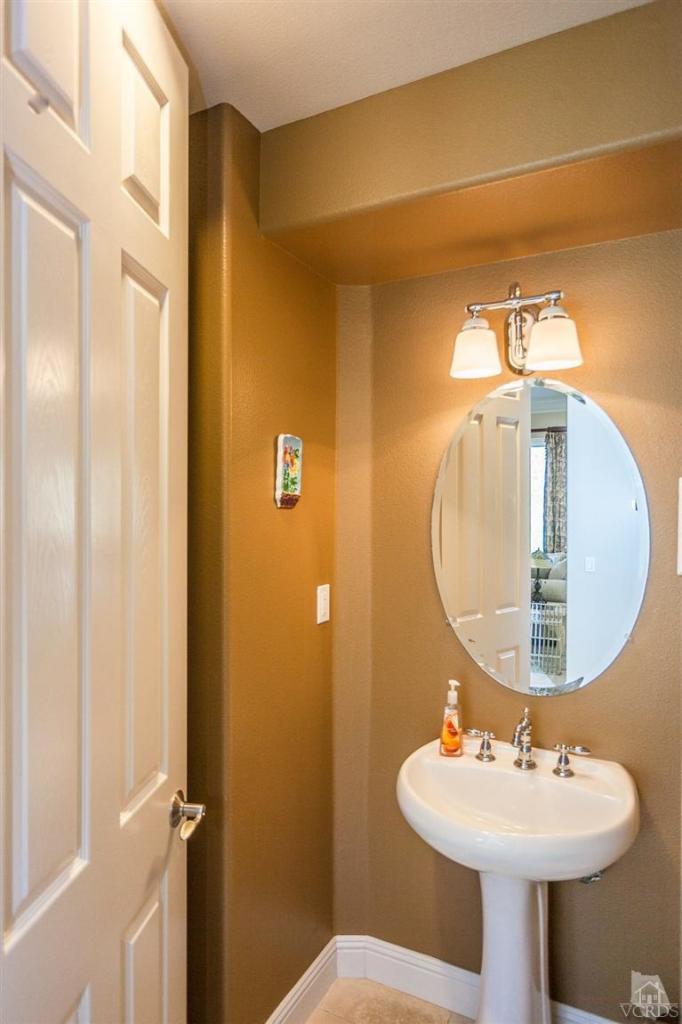 7351 Sarazen Drive Moorpark, CA 93021 - Photo 15 of 39 a bathroom with a sink and mirror