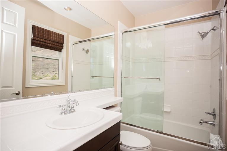 7351 Sarazen Drive Moorpark, CA 93021 - Photo 28 of 39 a bathroom with a sink toilet and shower
