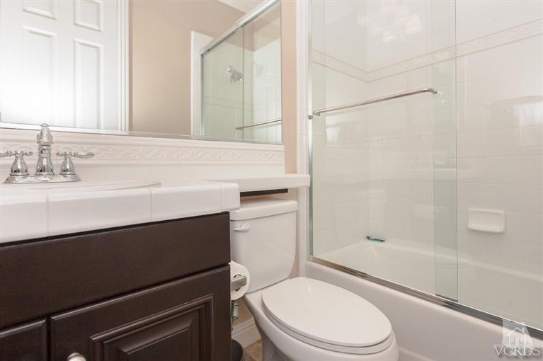 7351 Sarazen Drive Moorpark, CA 93021 - Photo 30 of 39 a bathroom with a sink a toilet and shower