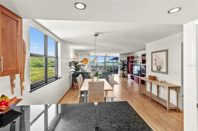 a bedroom with a bed and a flat tv screen on dresser