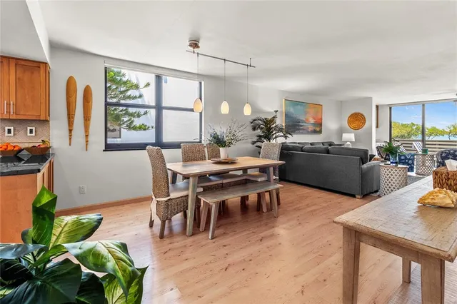 a view of a workspace with furniture and window