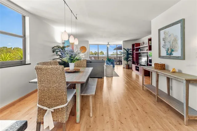 a view of a workspace with furniture and window