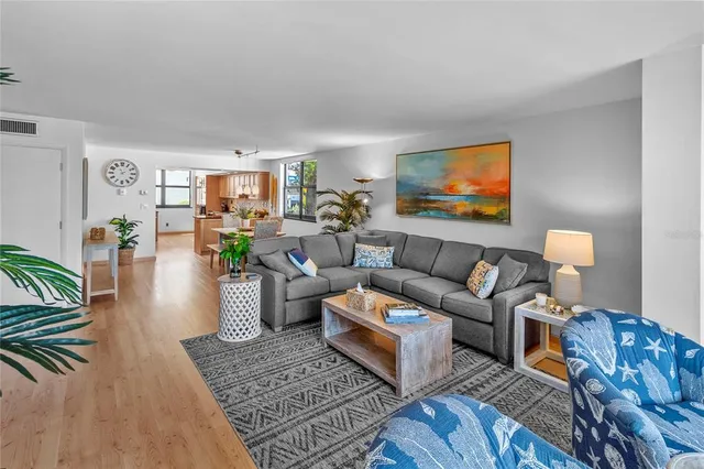 a view of a outdoor sitting area with furniture and umbrella