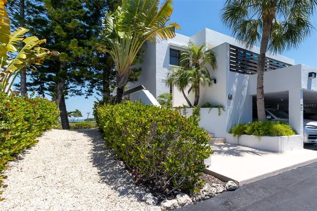 a kitchen with stainless steel appliances a refrigerator and a stove top oven