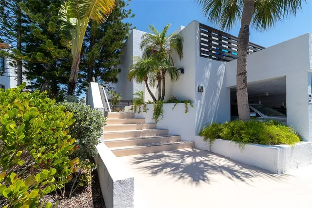 a kitchen with stainless steel appliances kitchen island granite countertop a stove a sink and a microwave